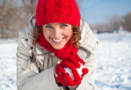 0187-happy_young_woman_playing_snowball_fight.jpg