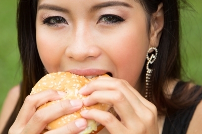0244-girl_eating_a_cheeseburger.jpg