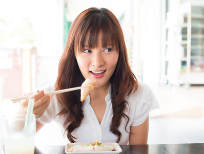 0382-asian_girl_eating_dim_sum.jpg